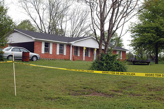 Police barricades hide the grisly scene inside the home of former MTV celebrity Bill Bellamy.